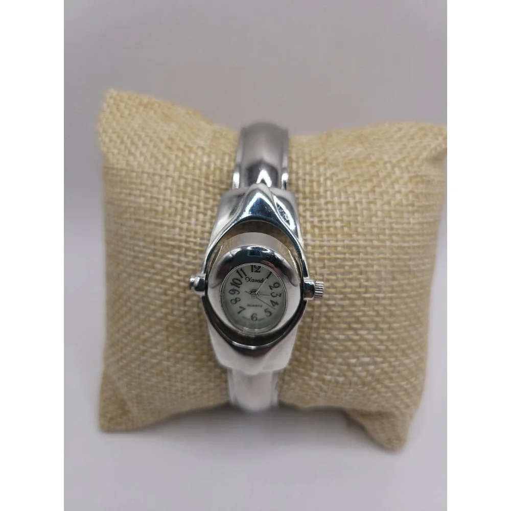 Xanadu Women's Silver Tone Hinged Cuff Bangle Quartz Watch Oval Dial Reverse